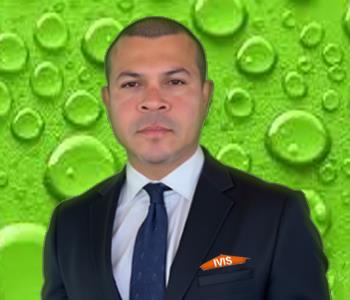 SERVPRO employee in front of green background